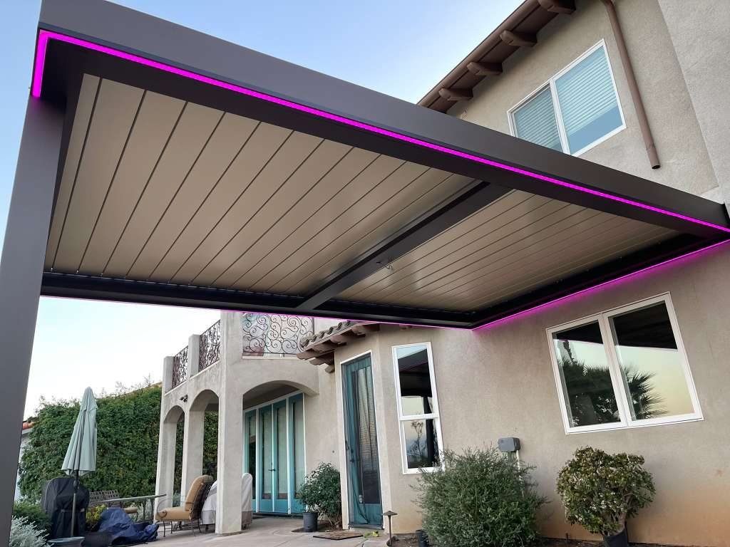 Four Seasons louvered roof with drop screens beside a swimming pool