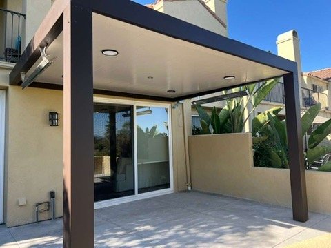 Insulated patio cover with recessed lighting and stucco surround
