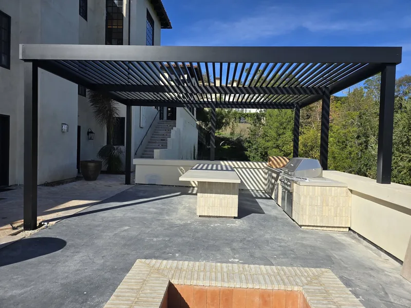 Large freestanding 4K patio cover with 2-inch lattice at wider spacing on six posts, over an outdoor kitchen