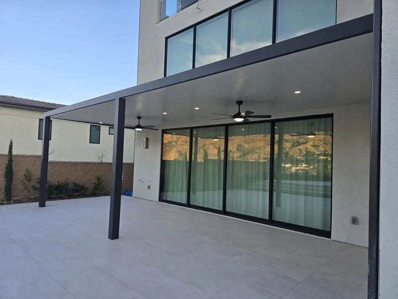 Attached 4K frame in espresso with white 3-inch insulated roof, two ceiling fans and three recessed lights